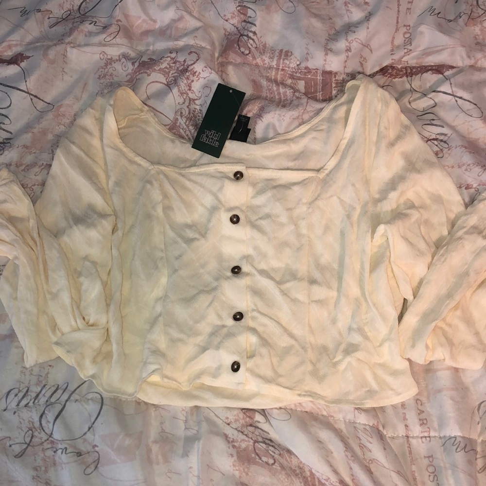 Light tan and white button down blouse.